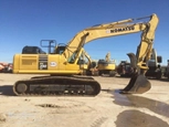 Side of used Komatsu Excavator in yard